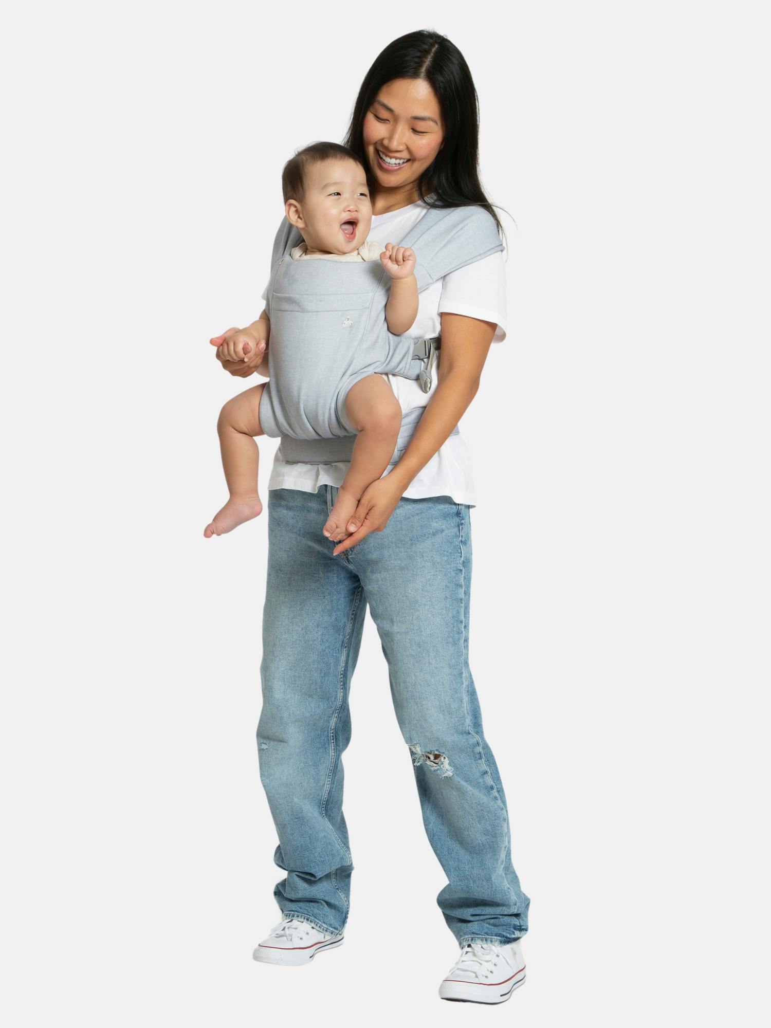 Image 1 of 6, The babyGap Legacy Baby Carrier effortlessly merges the coziness of a soft wrap with the simplicity of a carrier., The ultimate solution for hands-free baby carrying, this carrier features a supportive waistbelt and spreadable cross straps to ensure parent comfort., The carrier supports 3 positions: inward newborn, inward infant and outward infant., A detachable sleeping hood with Brannan Bear-inspired details that makes it uniquely babyGap., Convenient front pocket for easy storage of your essentials., Adjustable head support allows newborn use without additional insert needed., Ergonomic and hip healthy “M” seat position when facing in is ideal for babies., Easy to clean, machine washable design, machine wash cold, dry flat.