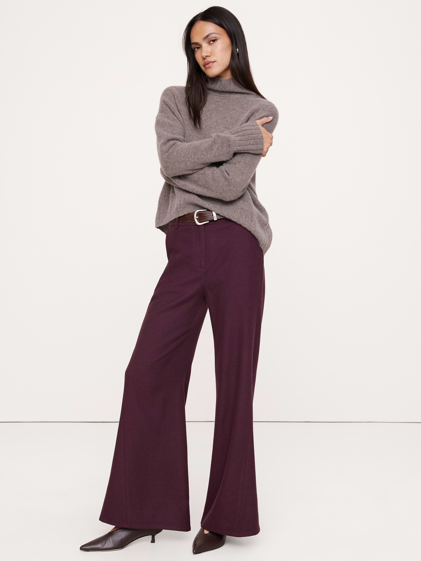 Image 1 of 8, We crafted this high-rise pant from a warm Italian wool-blend flannel and wrapped the outseam forward for a leg-lengthening silhouette., High-Rise Wide-Leg: High rise. Fitted waist, relaxed through the hip and thigh with a wide flared leg. Twisted seam., Fabric from Italy's Manifattura Emmetex., Zip fly with hook-and-bar closure. Belt loops., Elastic waist at back., Front and back pockets., Unlined., Product #1183002