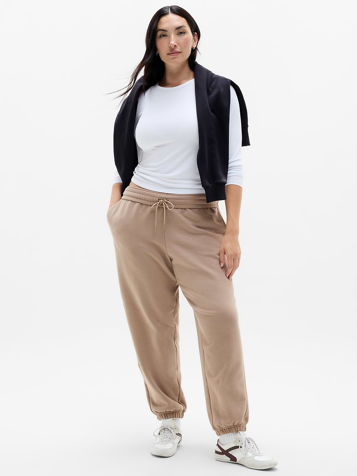 Image 1 of 6, FOR: Lounge and everyday movement, FEEL: Plush stretch fleece has a soft, brushed interior, FAVE: New and improved three-track waistband for extra support, Easy-access pockets to stash your essentials, Product #1174475