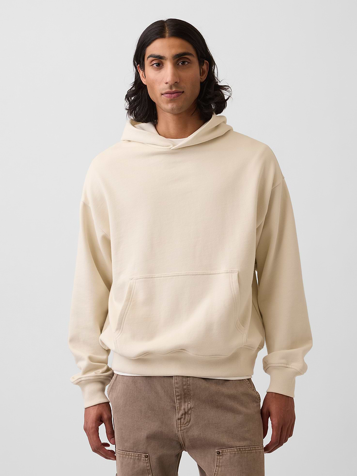Image 1 of 6, Soft, heavyweight cotton-blend fleece pullover hoodie., Hooded neckline., Long sleeves with banded cuffs., Kanga pocket., Banded hem., This hoodie is made with 14% recycled polyester. Compared to virgin materials, using recycled materials helps to reduce resource use and waste., Explore our GapSweats Guide ., This product was made in a factory that invests in gender equity and women’s empowerment through RISE. Learn more at gapinc.com/equity ., Product #821270