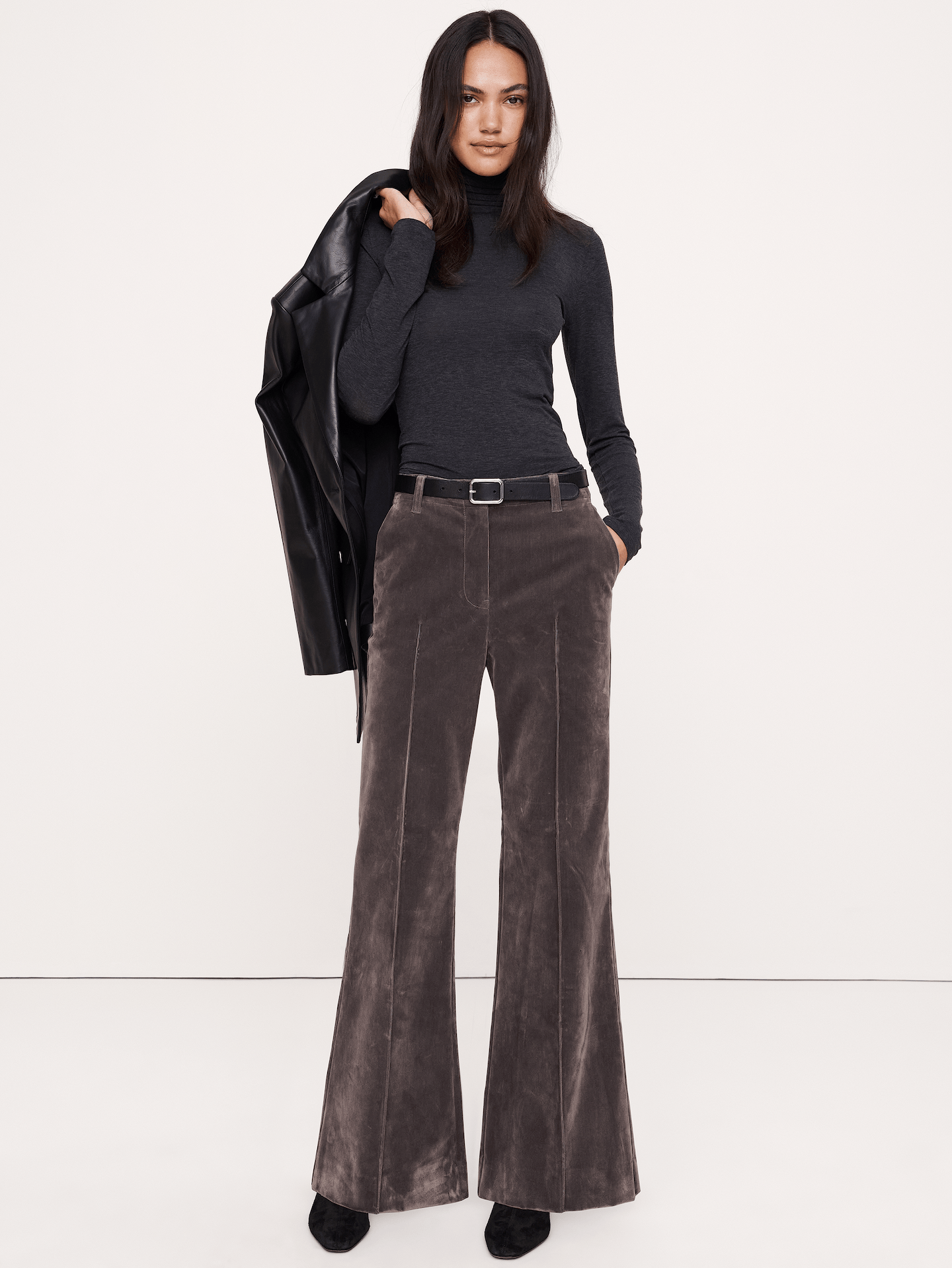 Image 1 of 8, Our most exaggerated flare of the season, we added a pintuck detail to the front so they're a little dressed-up. Crafted here in a soft-stretch denim with a velvety, flocked finish., Ultra-high rise. Straight through the hip and thigh with a super flared leg. Full length., Zip fly with hook-and-bar closure., Front and back pockets., Unlined., Product #1181557