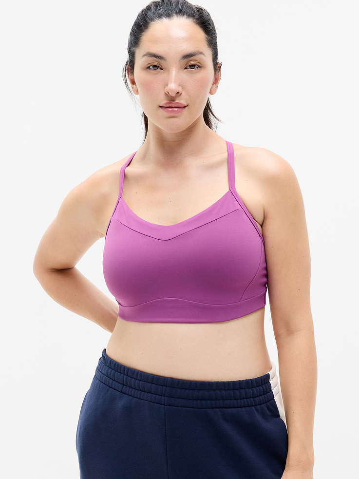 Image 1 of 5, BEST FOR STUDIO: yoga + barre + pilates, IMPACT: Light-impact workouts, best for D-DD cups, FEEL: Powervita fabric is buttery soft with support that feels like a gentle hug, FAVE: Sleek racerback design provides distraction-free mobility and airflow, Built-in pockets with removable pads for optional coverage, Lined with PowerMesh for breathable, sheer-proof coverage, Product #769482