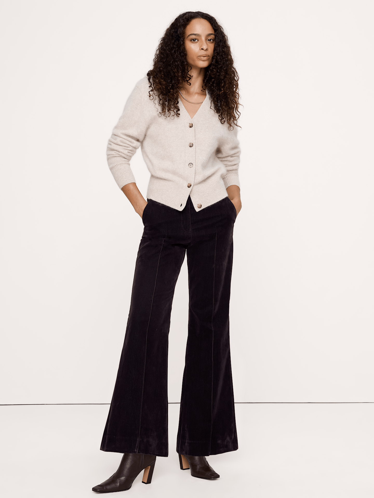 Image 1 of 8, Our most exaggerated flare of the season, we added a pintuck detail to the front so they're a little dressed-up. Crafted here in a soft-stretch denim with a velvety, flocked finish., Ultra-high rise. Straight through the hip and thigh with a super flared leg. Full length., Zip fly with hook-and-bar closure., Front and back pockets., Unlined., Product #1181557
