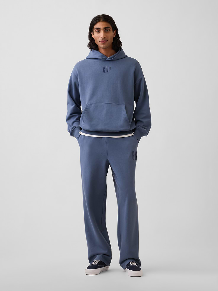Image 1 of 6, Soft, heavyweight cotton-blend fleece sweatpants. In a relaxed fit., Elasticized waist., Side slant pockets, back welt pockets., Gap logo at front., Product #912709