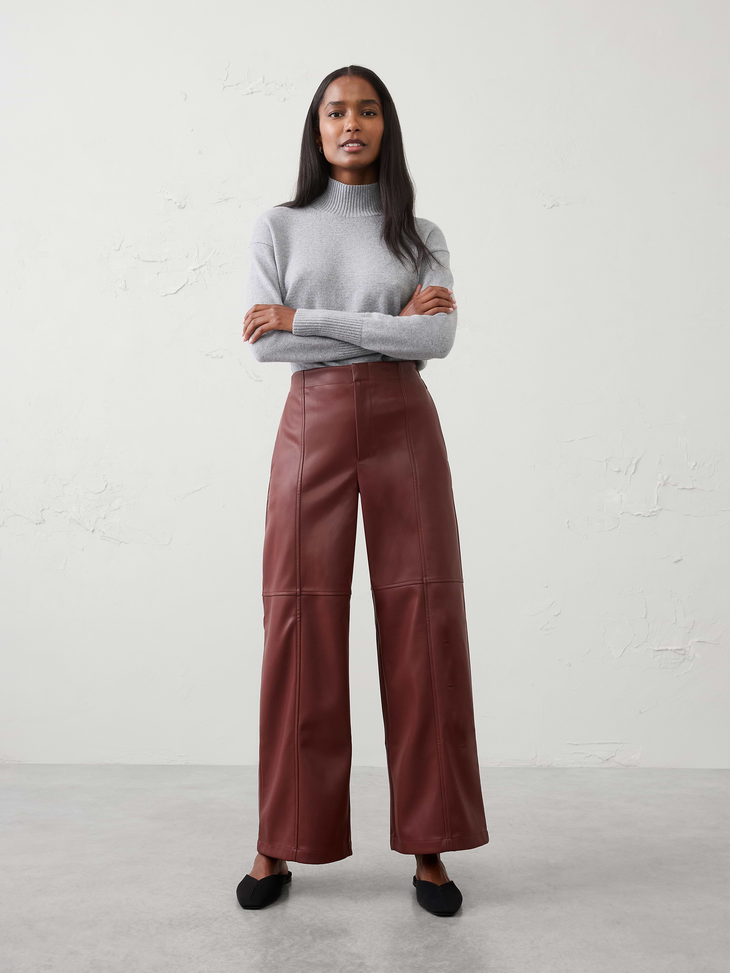 Image 1 of 5, A fashion‑forward take on a wardrobe staple, this vegan leather pant is designed with a flattering high rise and wide‑leg silhouette. An elasticized back waistband adds comfort and ease, balancing elevated style with everyday wearability., VEGAN LEATHER: Soft and smooth, this faux leather looks and feels luxurious., Relaxed fit. High rise. Wide leg. Full length., Hook-and-bar closure with zip fly., Clean front waistband., Elasticized back waistband., On seam side pockets., Back welt pockets., Vertical seaming through the front and back legs., Horizontal seam detail at the knee., Made exclusively for Banana Republic Factory., Product #1178136