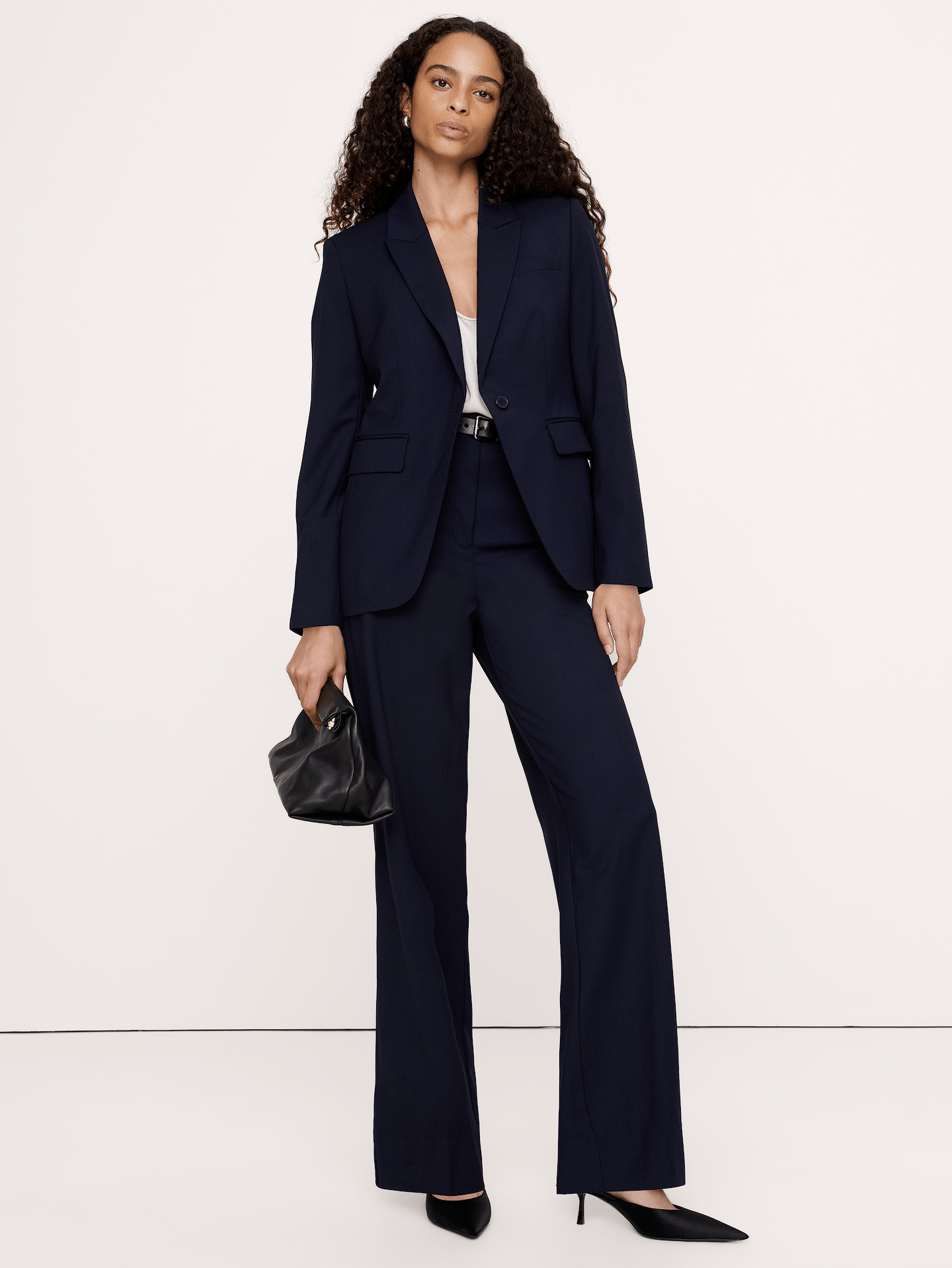 Image 1 of 8, We cut this pant for a sleek and sharply-tailored fit, opting for a barely-there Hollywood waistband and darts at the back waist to create a clean look that's also ultra-comfortable. For fabric, we reached for our Siena Italian wool—a customer favorite for its all-weather weight and hint of stretch., Ultra High Rise Modern Slim: Ultra high rise with a slim fit through the thighs and a straight leg. Full length., Fabric from Italy's Marzotto mill., Zip fly with hook-and-bar closure., Front and back pockets., Unlined., Product #539384