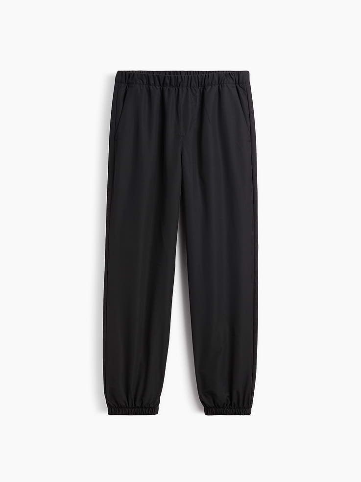 Image 1 of 3, This product is made with/contains 23% recycled polyester. Compared to virgin materials, using recycled materials helps reduce resource use and waste., Smooth water and wind-resistant outer., Interior fleece lining., Elasticized waist, faux fly., Front slant pockets., Elasticized cuffs., Product #1185345