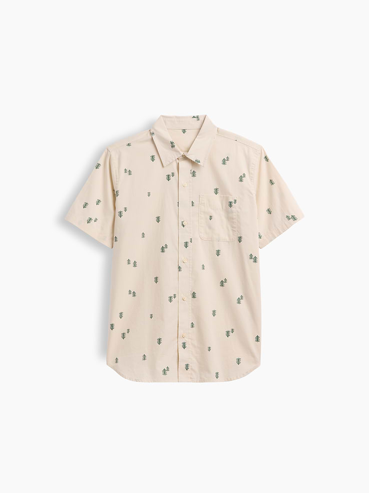 Image 1 of 3, Smooth poplin weave., Short sleeves., Spread collar, button front., Patch pocket at chest., Curved hem., Select styles have allover print or stripes., This product was made in a factory that invests in gender equity and women’s empowerment through RISE. Learn more at, Product #1175107
