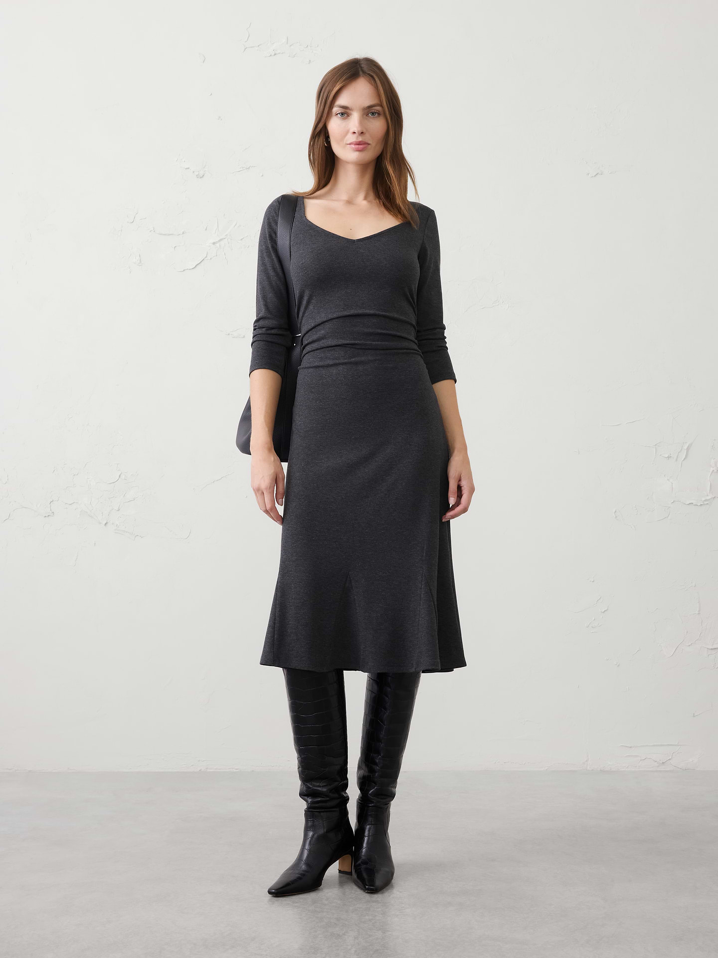 Image 1 of 3, Our customer‑favorite Cozy Rib fabric returns in a flattering sweetheart neckline, enhanced with shirred detailing that creates soft texture and shape. Designed for all‑day comfort and effortless style, it's an easy, feminine dress you'll reach for again and again., SUSTAINABILITY: Made with 60% recycled polyester., Sweetheart neckline. Long sleeves., Shirred detailing at the waist creates flattering shape and dimension., Godet panel inserts add volume and movement through the lower skirt., Flared hem creates a graceful fit‑and‑flare silhouette., Made exclusively for Banana Republic Factory., Product #1185692