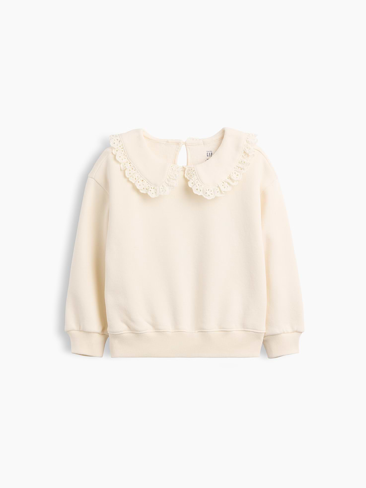 Image 1 of 2, Our softer than soft sweats. Brushed on the inside. Smooth on the outside. Made so that no two are alike., Soft cotton-blend fleece pullover sweatshirt., Peter Pan collar with scalloped eyelet trim and keyhole loop button closure at back., Long sleeves with drop shoulders., Banded rib cuffs and hem., Made with 52% Protocol cotton verified by the U.S. Cotton Trust Protocol, a program which works with farms committed to improving their environmental footprint by minimizing water usage and improving soil health (Claim No. 10127)., Made with 23% recycled polyester. Compared to virgin materials, using recycled materials helps reduce resource use and waste., Product #912876