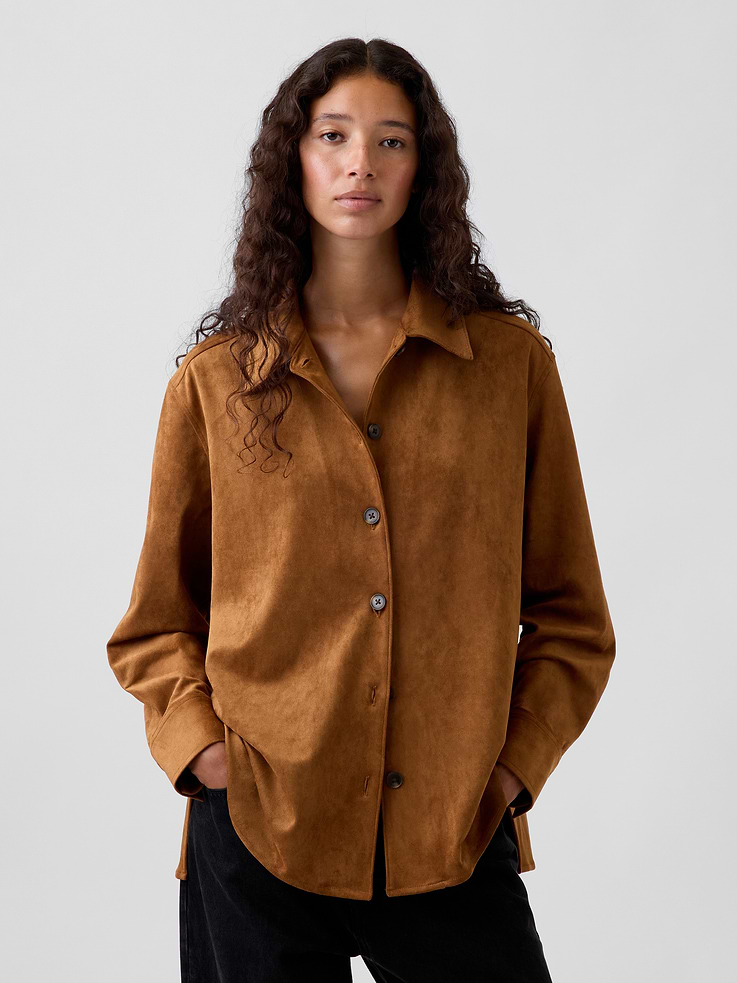 Image 1 of 5, Soft, stretch vegan suede button-up shirt. In a relaxed fit in a longer length., Spread collar, button front., Long sleeves with button cuffs., Back yoke seam., This product was made in a factory that invests in gender equity and women’s empowerment through RISE. Learn more at gapinc.com/equity ., Product #1184322