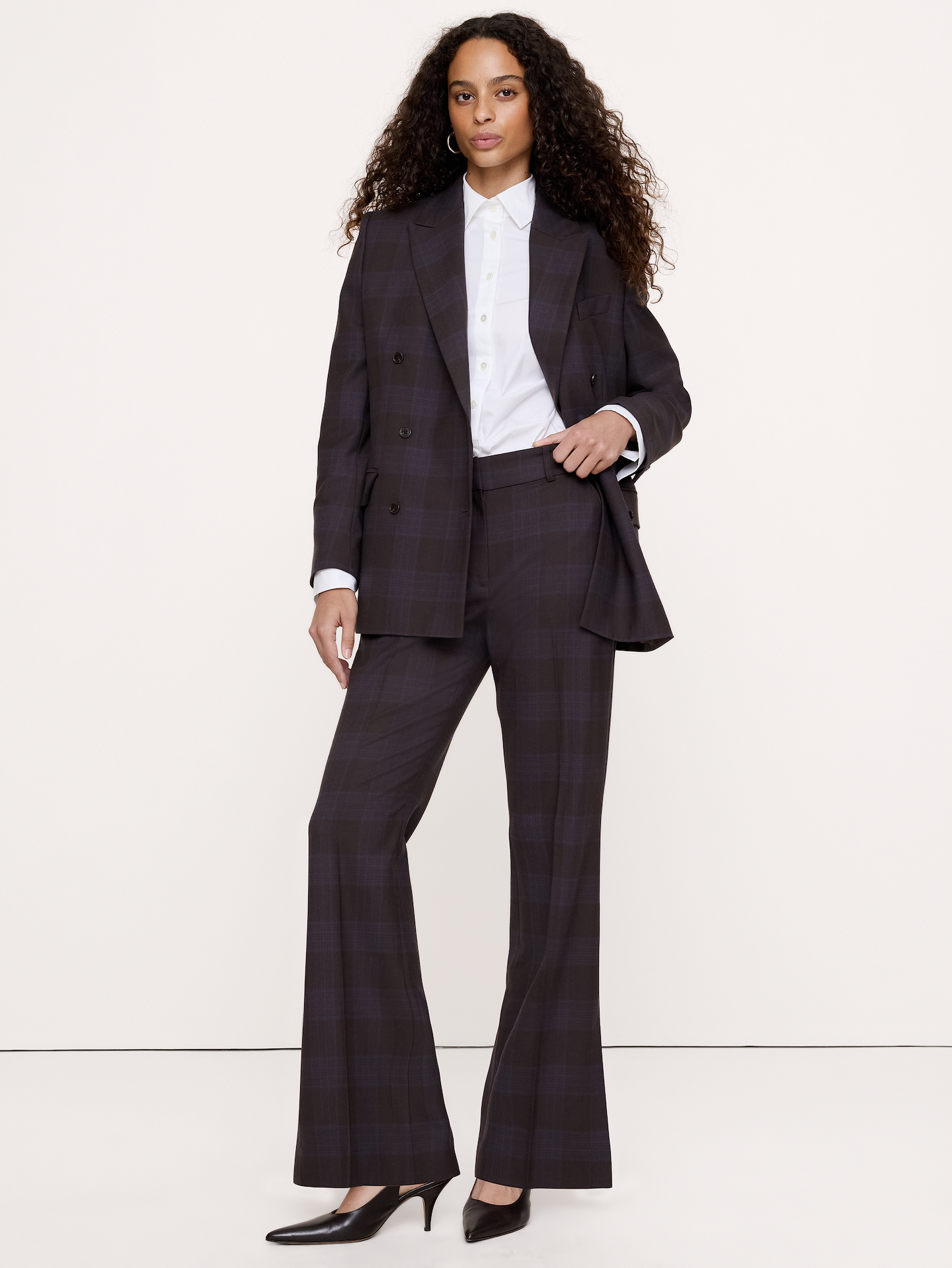 Image 1 of 8, The pant we've been dreaming of. This one brings the 2000s vibes with a high-rise flared silhouette and a barely-there waistband design. Cut in an wool-blend we love for its smooth look and stretch., Flare Fit: High-rise. Slim through the hip and thigh with a flared leg. Full length., Zip front with hook-and-bar closure., Back pockets., Soft trouser crease., Unlined., Product #1182782