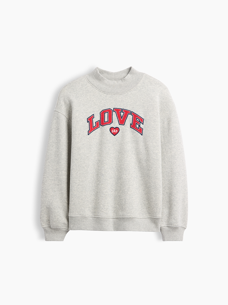 Image 1 of 3, Soft, comfy fleece., Dropped shoulder, long sleeves with banded cuffs., Mockneck., Gap logo at front., Banded hem., This product was made in a factory that invests in gender equity and women’s empowerment through RISE. Learn more at, Product #1178683