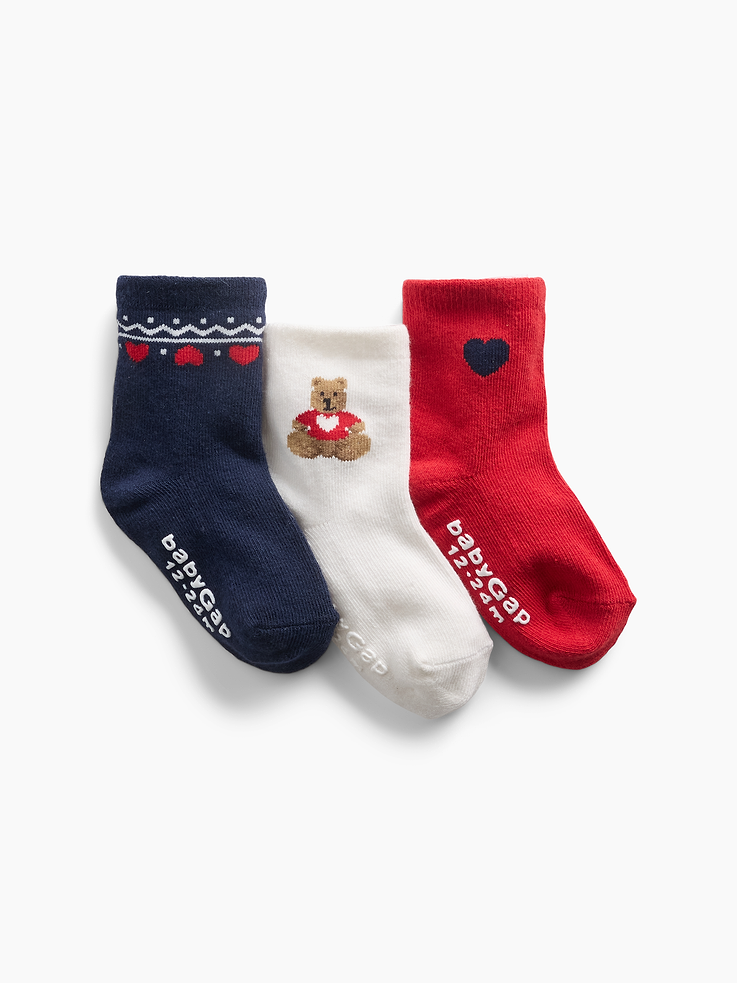 Image 1 of 2, Soft, stretch knit crew socks., Ribbed top., Reinforced toe and heel., Brannan Bear, heart graphics, and Fair Isle print., This product was made in a factory that invests in gender equity and women’s empowerment through RISE. Learn more at gapinc.com/equity ., Product #1185875