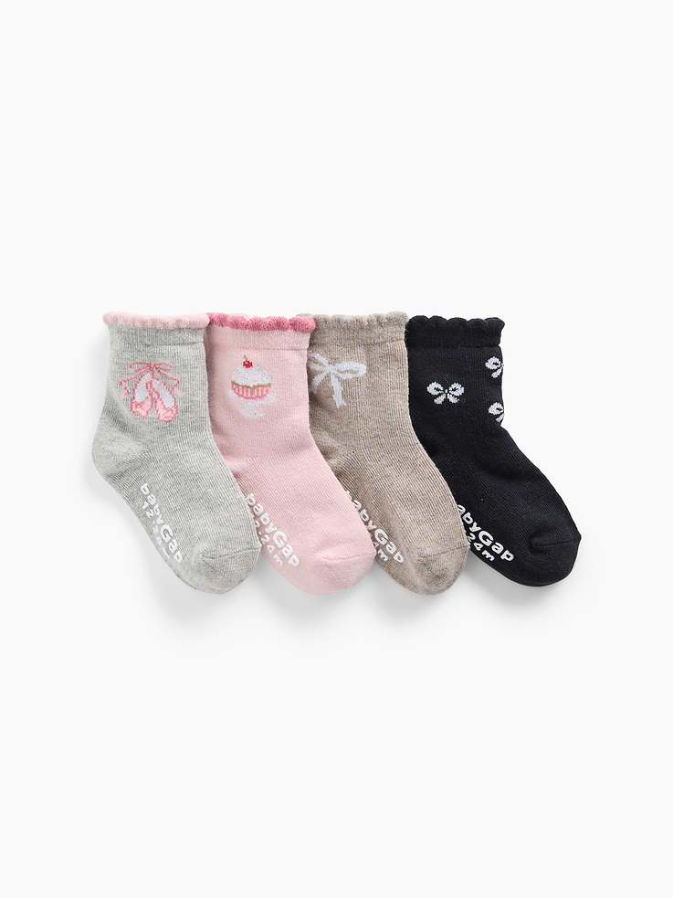 Image 1 of 2, Soft, stretch knit quarter crew socks., Ruffle trim at ribbed top., Reinforced toe and heel., Graphics at sides., This product was made in a factory that invests in gender equity and women’s empowerment through RISE. Learn more at gapinc.com/equity ., Product #1185873