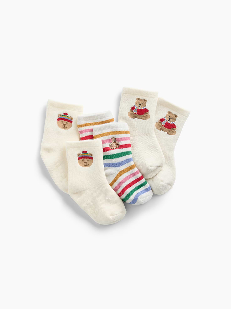 Image 1 of 2, Soft, stretch knit baby socks., Ribbed top., Reinforced toe and heel., Cozy Brannan Bear graphics and happy stripes., This product was made in a factory that invests in gender equity and women’s empowerment through RISE. Learn more at gapinc.com/equity ., Product #1186099