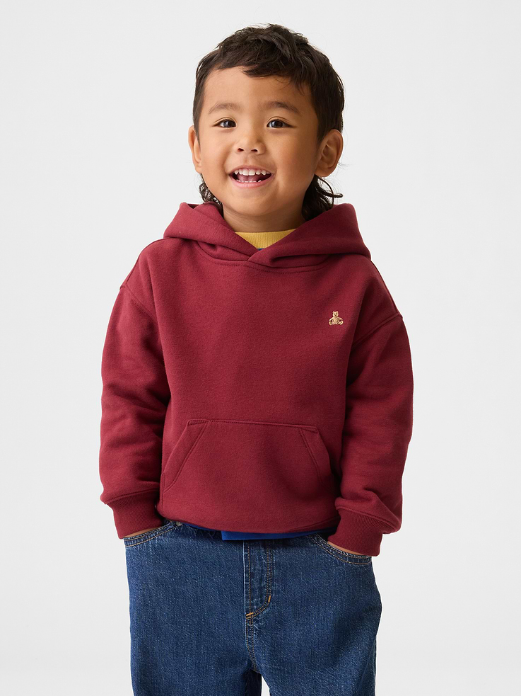 Image 1 of 4, Our softer than soft sweats. Brushed on the inside. Smooth on the outside. Made so that no two are alike., Soft cotton-blend relaxed fleece hoodie., Hooded neckline., Long sleeves with banded cuffs., Front kanga pocket., Banded hem., Embroidered Brannan Bear at chest., This product was made in a factory that invests in gender equality and women’s empowerment. Through RISE (Reimagining Industry to Support Equality) and Gap Inc.’s program P.A.C.E. (Personal Advancement & Career Enhancement), we support people who make our clothes to build the skills, knowledge, confidence, and resilience needed to advance in work and life. Learn more here ., Product #721328