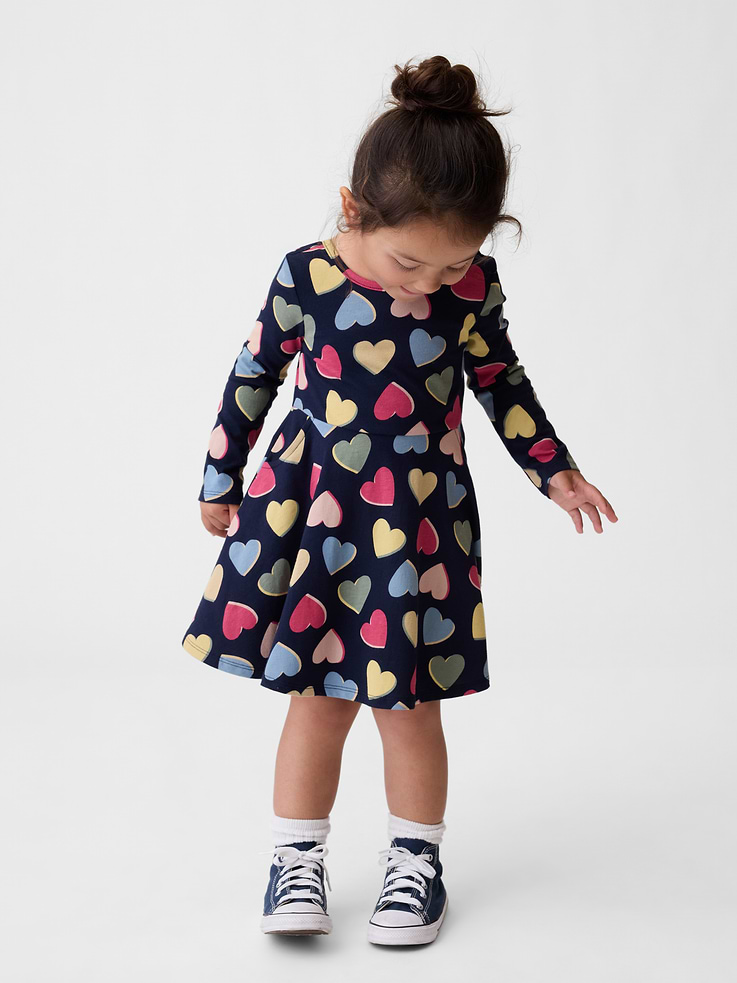 Image 1 of 3, Our favorite mix-and-match essentials go from tummy time to playtime in no time. All made with soft cotton in playful prints and bright colors., Soft cotton jersey twirl dress., Scoop neck and back., Long sleeves., Waist seam., Front scoop pockets., Made with 100% Protocol cotton verified by the U.S. Cotton Trust Protocol, a program which works with farms committed to improving their environmental footprint by minimizing water usage and improving soil health (Claim No. 10127)., Product #912109