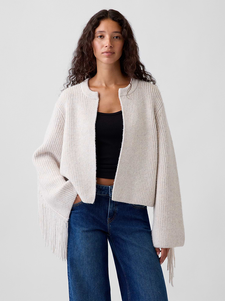 Image 1 of 5, Soft, ribbed knit cardigan sweater. In a relaxed fit and slightly cropped length., Crewneck., Open front., Long sleeves with drop shoulders., Fringe detail at back and sleeves., Product #1187965