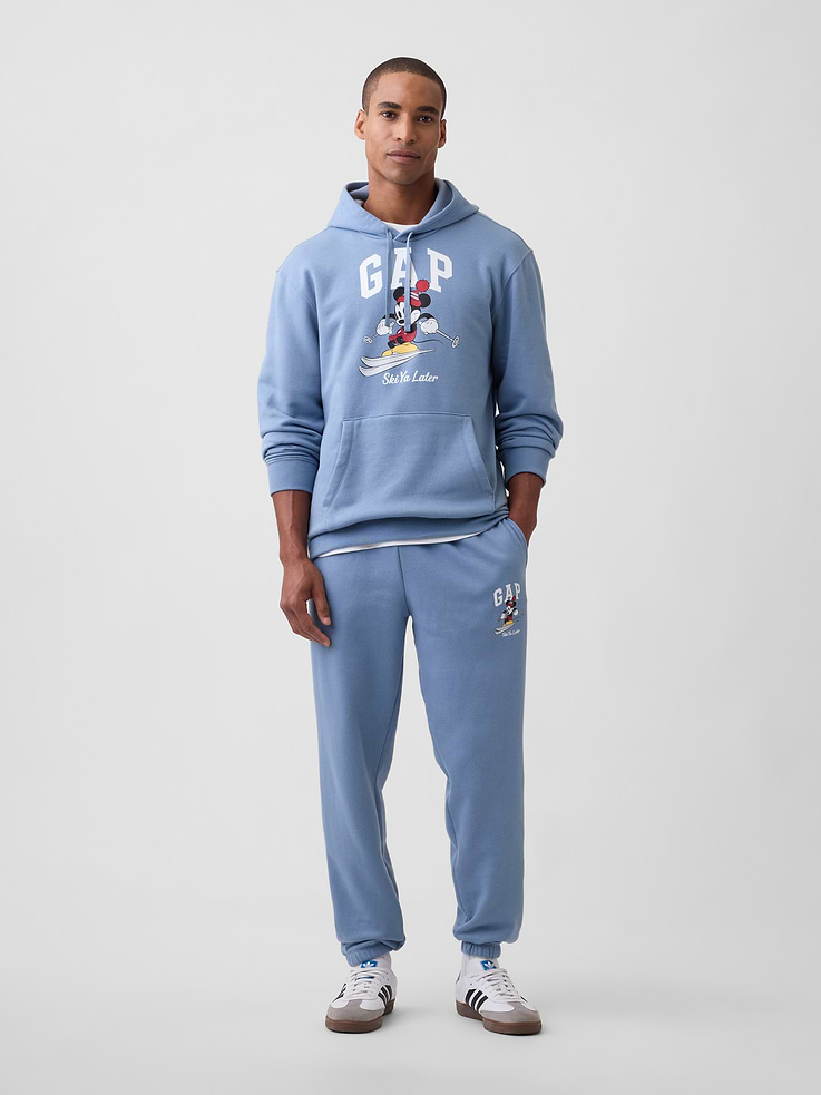 Image 1 of 4, A very special collaboration between Gap and Disney— two timeless, iconic American brands— led us to create a collection that celebrates Mickey Mouse and Minnie Mouse., This product is made with/contains 23% recycled polyester. Compared to virgin materials, using recycled materials helps reduce resource use and waste., Soft, comfy fleece., Drawcord ties at elasticized waist., On-seam pockets, patch pocket at back., Gap logo with graphic at leg., Elasticized cuffs., Product #1187820