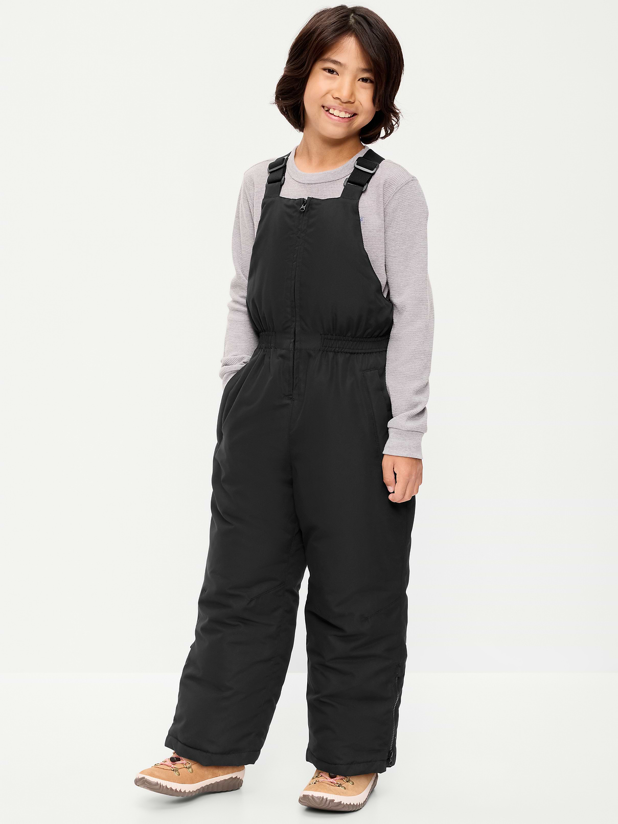Image 1 of 4, high straight neckline, adjustable elasticized shoulder straps, elasticized waist, diagonal welt zippered pockets in front, single adhesive secure close pocket at back, zippered side panels at ankles, hidden interior storm cuffs, water-resistant, Product #907912