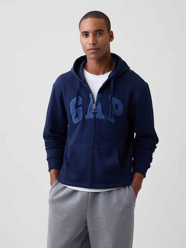 Image 1 of 4, This product is made with/contains 23% recycled polyester. Compared to virgin materials, using recycled materials helps reduce resource use and waste., Soft, comfy fleece., Dropped shoulder, long sleeves with banded cuffs., Drawcord ties at hood, zip front., Gap logo at front., Kanga pockets., Product #1188934