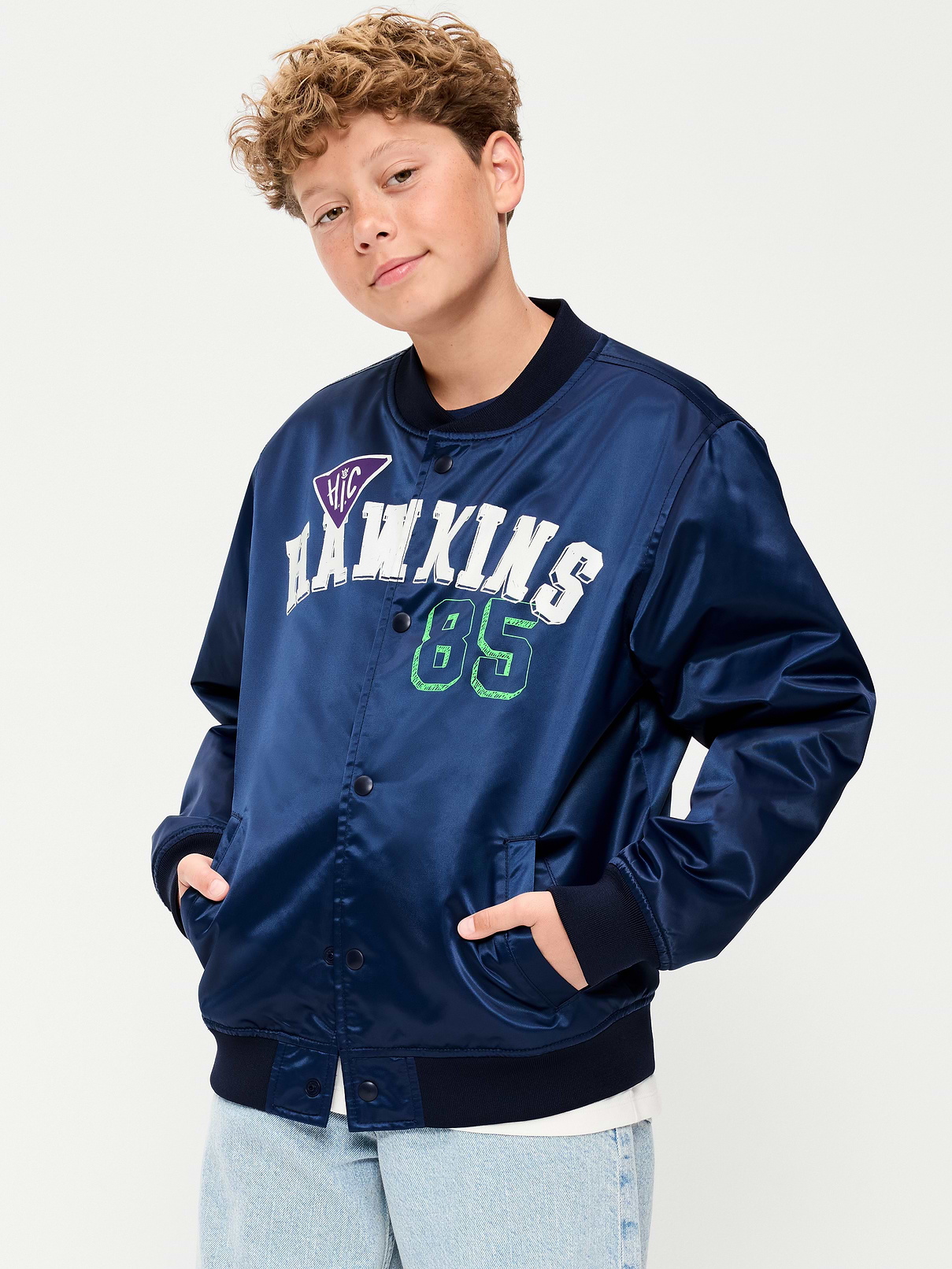 Image 1 of 4, standing rib-knit collar, long sleeves, full-length snap-button placket, diagonal welt pockets at front, rib-knit hem, licensed graphic, Stranger Things: Tales From 85™/ © Netflix. Used with permission., Product #1185068
