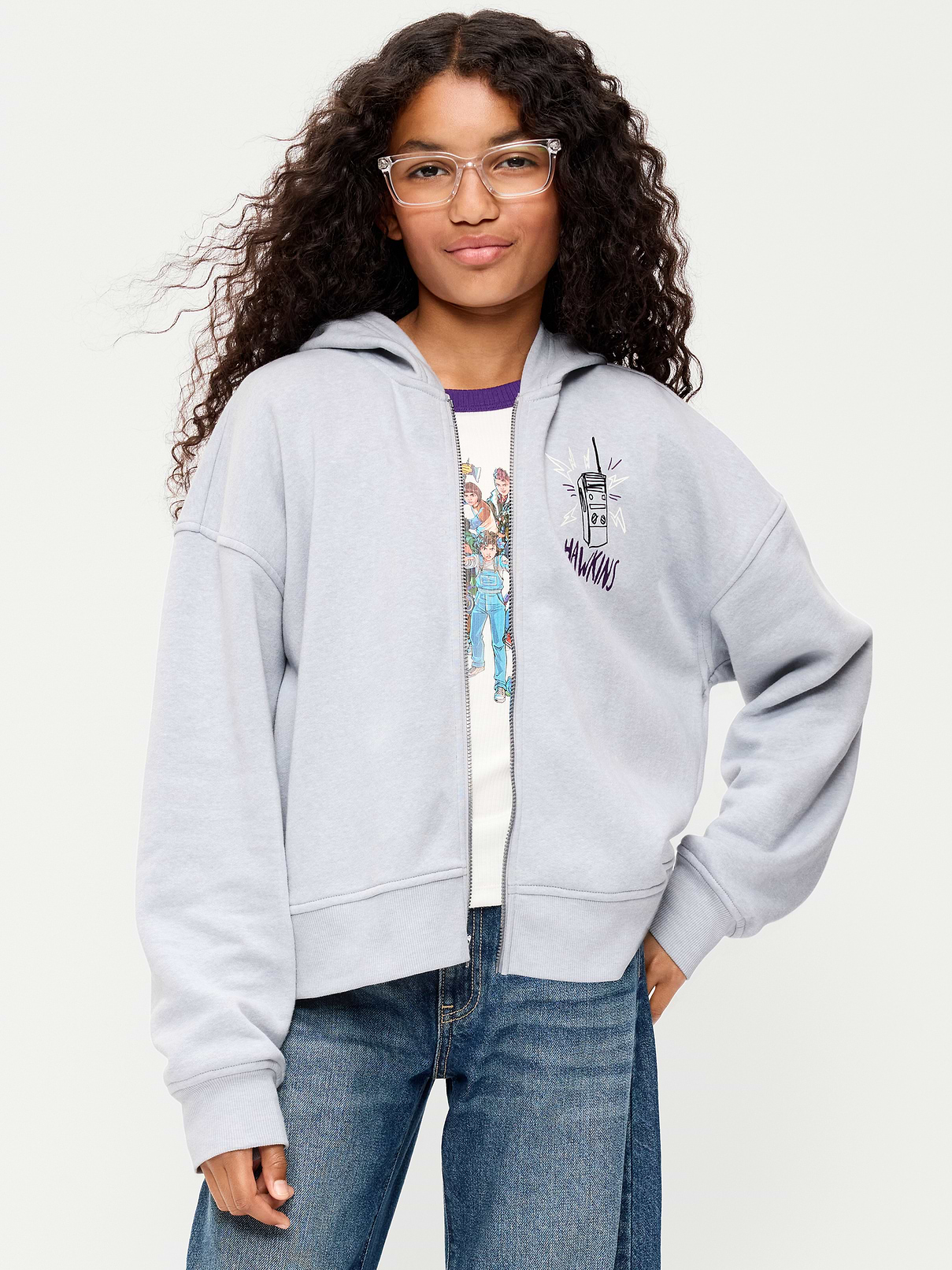 Image 1 of 3, built-in hood, long sleeves, drop shoulders, licensed graphic at front and back, full length zipper, Stranger Things: Tales From 85™/ © Netflix. Used with permission., Product #1185063