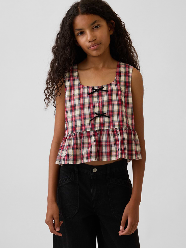 Image 1 of 5, Soft cotton top., Square neck., Back button placket., Sleeveless., Tacked bows at front., Peplum hem., Product #1184466
