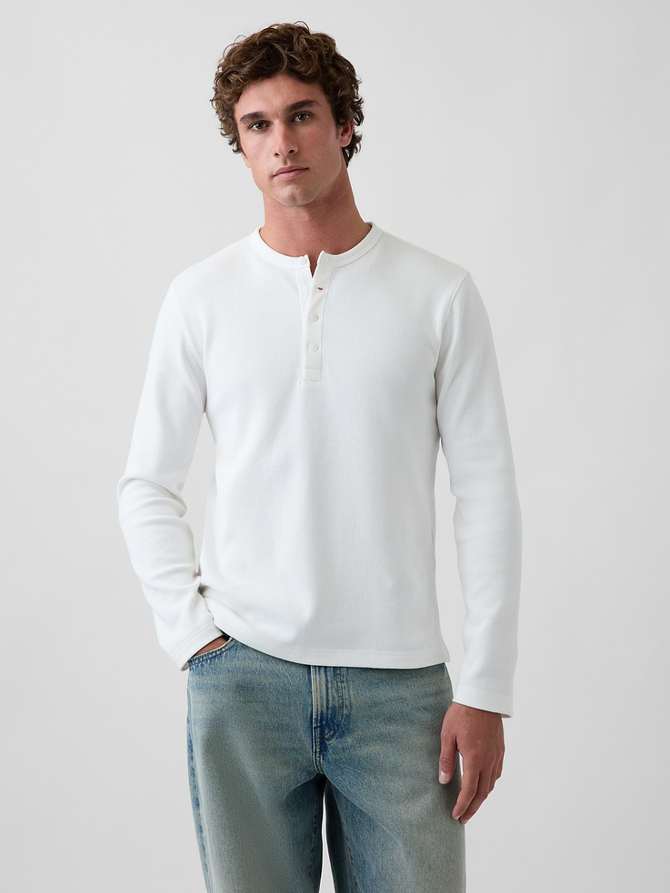 Image 1 of 5, Soft, waffle-knit stretch cotton Henley T-shirt., Crewneck with front button placket., Long sleeves., This product was made in a factory that invests in gender equity and women’s empowerment through RISE. Learn more at gapinc.com/equity ., Product #1185662
