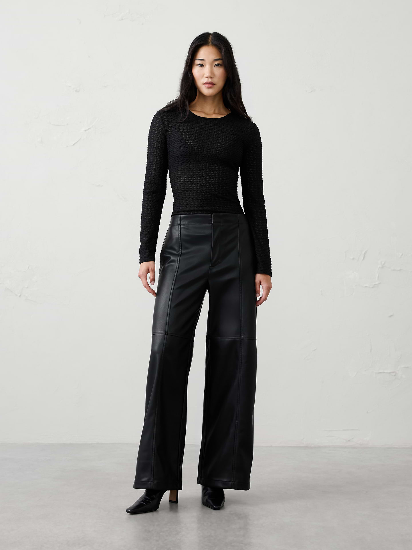 Image 1 of 5, A fashion‑forward take on a wardrobe staple, this vegan leather pant is designed with a flattering high rise and wide‑leg silhouette. An elasticized back waistband adds comfort and ease, balancing elevated style with everyday wearability., VEGAN LEATHER: Soft and smooth, this faux leather looks and feels luxurious., Relaxed fit. High rise. Wide leg. Full length., Hook-and-bar closure with zip fly., Clean front waistband., Elasticized back waistband., On seam side pockets., Back welt pockets., Vertical seaming through the front and back legs., Horizontal seam detail at the knee., Made exclusively for Banana Republic Factory., Product #1178136