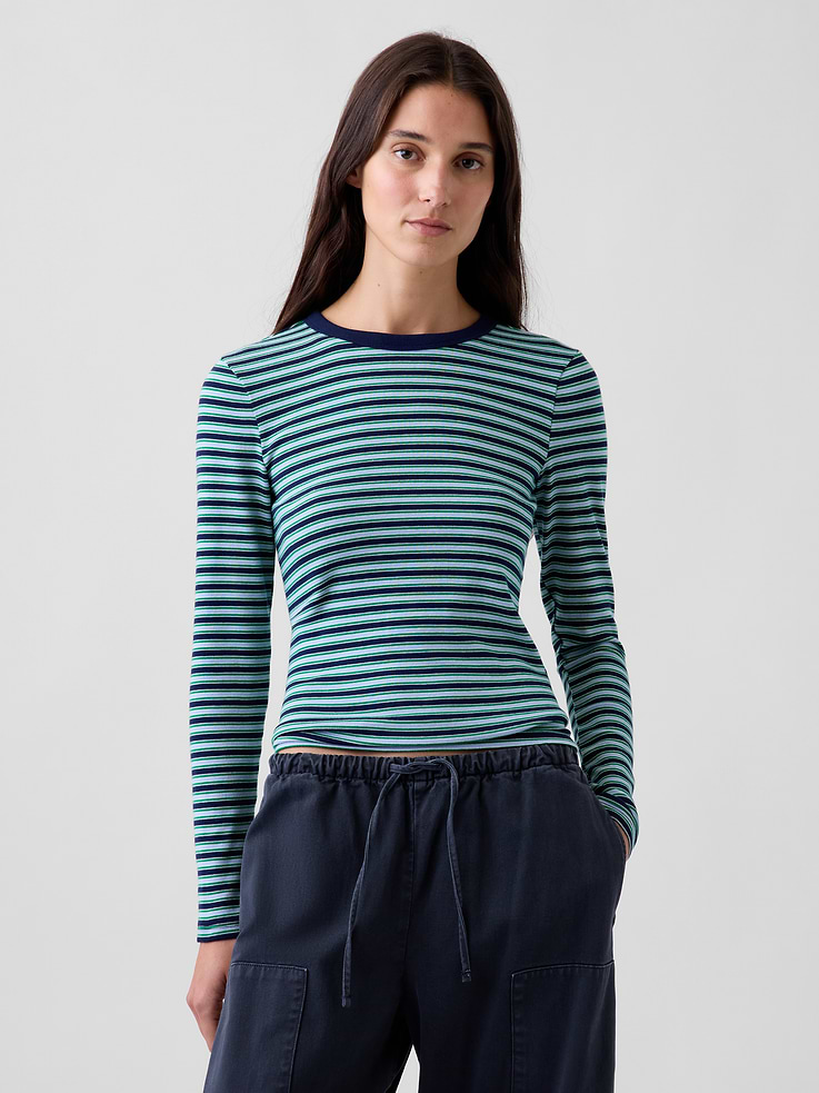 Image 1 of 3, Our soft & stretchy cotton-modal blend that hugs you just right. It’s your new 7-days-a-week essential., Soft, stretch cotton-modal blend T-Shirt in a slightly cropped length., Crewneck., Long sleeves., This product was made in a factory that invests in gender equity and women’s empowerment through RISE. Learn more at gapinc.com/equity ., Product #801470