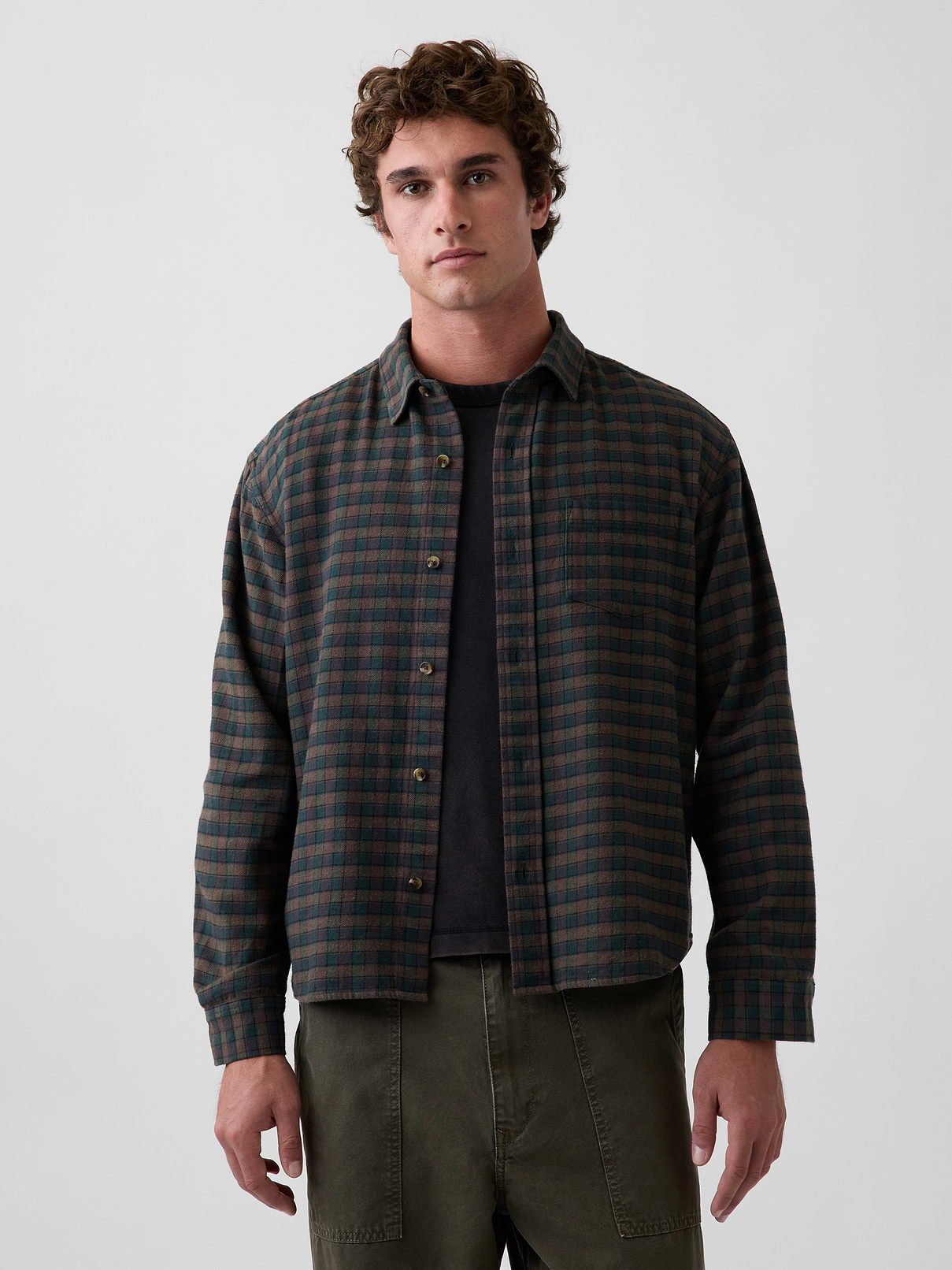Image 1 of 5, Soft cotton flannel button-up shirt. In a relaxed fit., Spread collar., Long sleeves with button cuffs., Button front., Chest patch pocket., Back yoke seam., Made with 100% organically grown cotton which is grown without the use of synthetic pesticides and fertilizers., Explore the Gap Gift Shop ., Product #904948