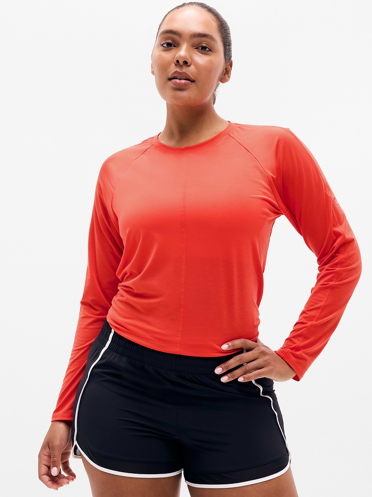 Image 1 of 6, FOR: Medium to high-impact workouts at the gym, studio, or outdoors, FEEL: The soft, lightweight feel of a vintage tee, engineered with the performance of a true training top, FAVE: Adjustable tie-back offers a secure fit for high-impact workouts like running, Product #1174483