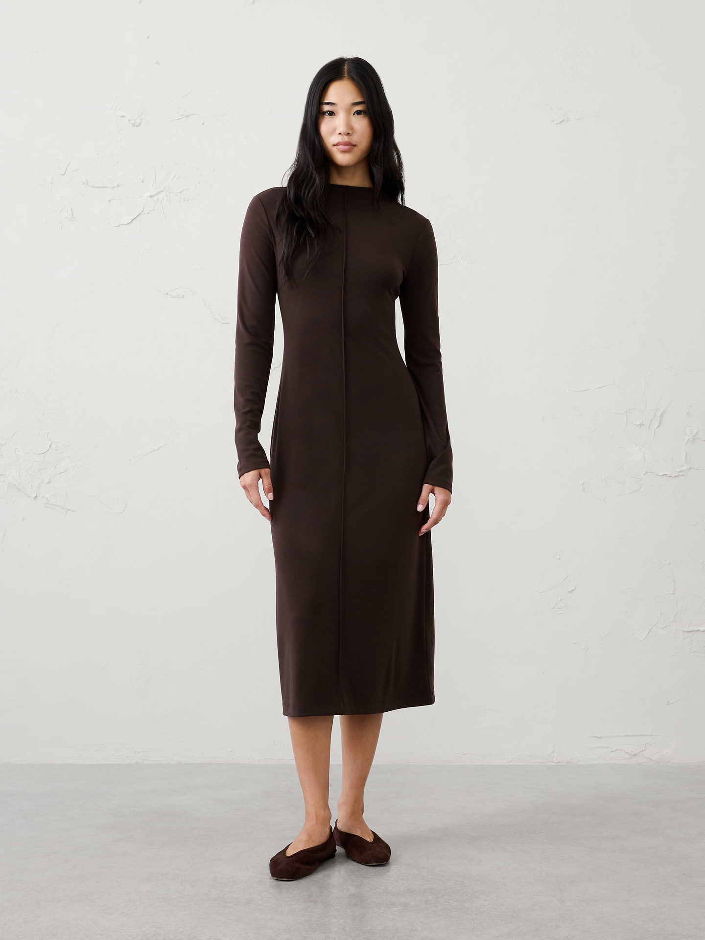 Image 1 of 7, SUSTAINABILITY: Made with 60% recycled polyester., Mock neck. Slightly longer sleeves., Features center front pintuck detailing., Fitted at waist., Straight hem., Made exclusively for Banana Republic Factory., Product #1181238