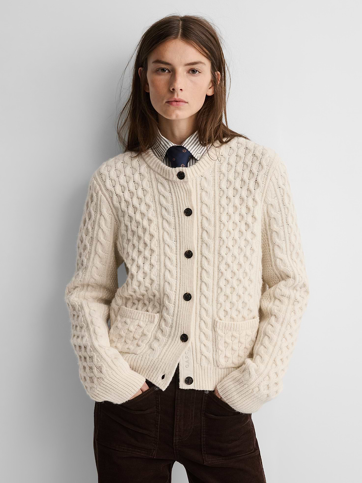 Image 1 of 8, Soft cable-knit wool cardigan., Crewneck., Long sleeves., Button front with Gap × A.P.C. logo at placket., Patch pockets at front., Banded hem and cuffs., Product #1179768
