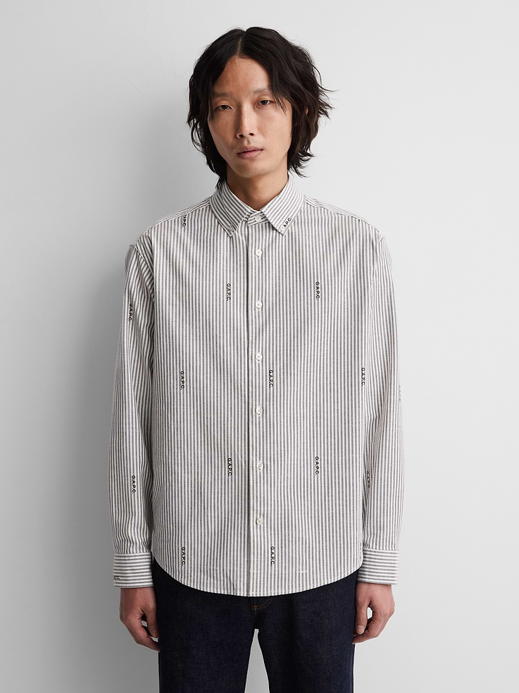 Image 1 of 8, Soft, stretch cotton-blend Oxford shirt., Point collar, button front., Long sleeves with button cuffs., Allover stripes., Gap × A.P.C. logo allover., Product #1179803