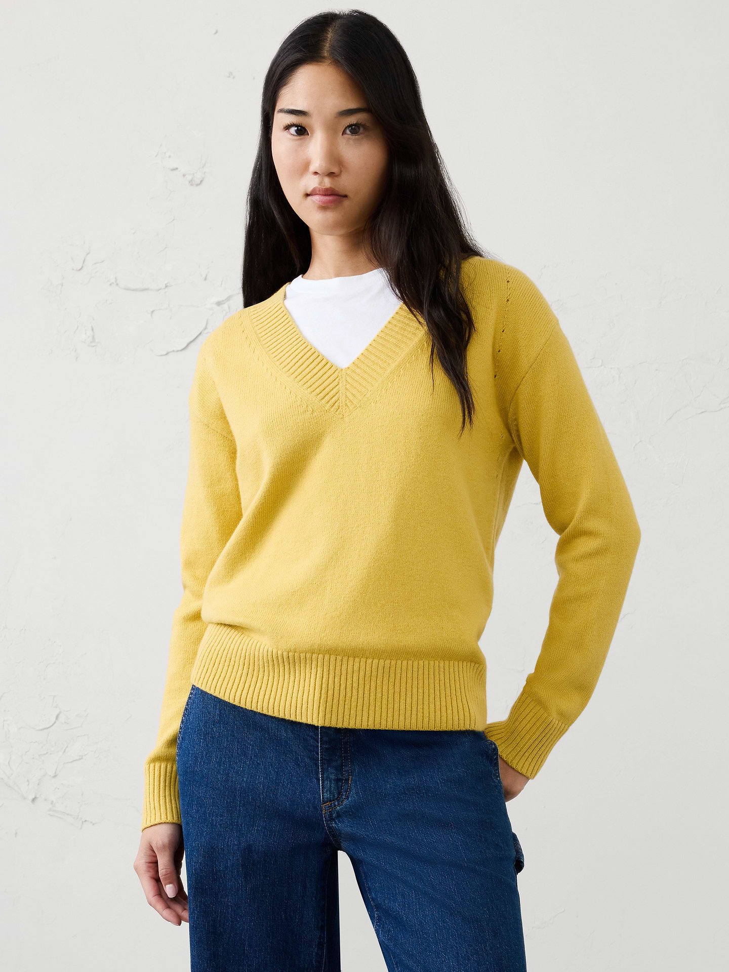 Image 1 of 7, Our sweater is knit from our signature Perfectly Soft yarn—a luxurious blend of cotton with a hint of wool, that feels as cozy as it looks., V-neckline. Long sleeves., Ribbed neck, arm cuffs and hem., Made exclusively for Banana Republic Factory., Product #1176456