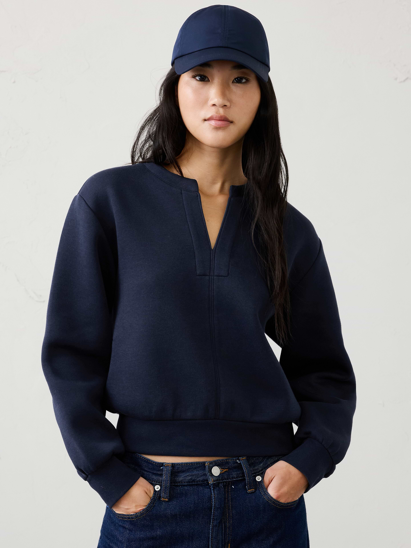 Image 1 of 4, Crafted from our best‑selling Weekender fabric, this sweatshirt combines exceptional softness with built‑in stretch for all‑day comfort and ease of movement. Comfortable yet polished, it’s an effortless go‑to for everyday wear., Splitneck collar. Long raglan sleeves., Fitted band hem., Made exclusively for Banana Republic Factory., Product #1185881