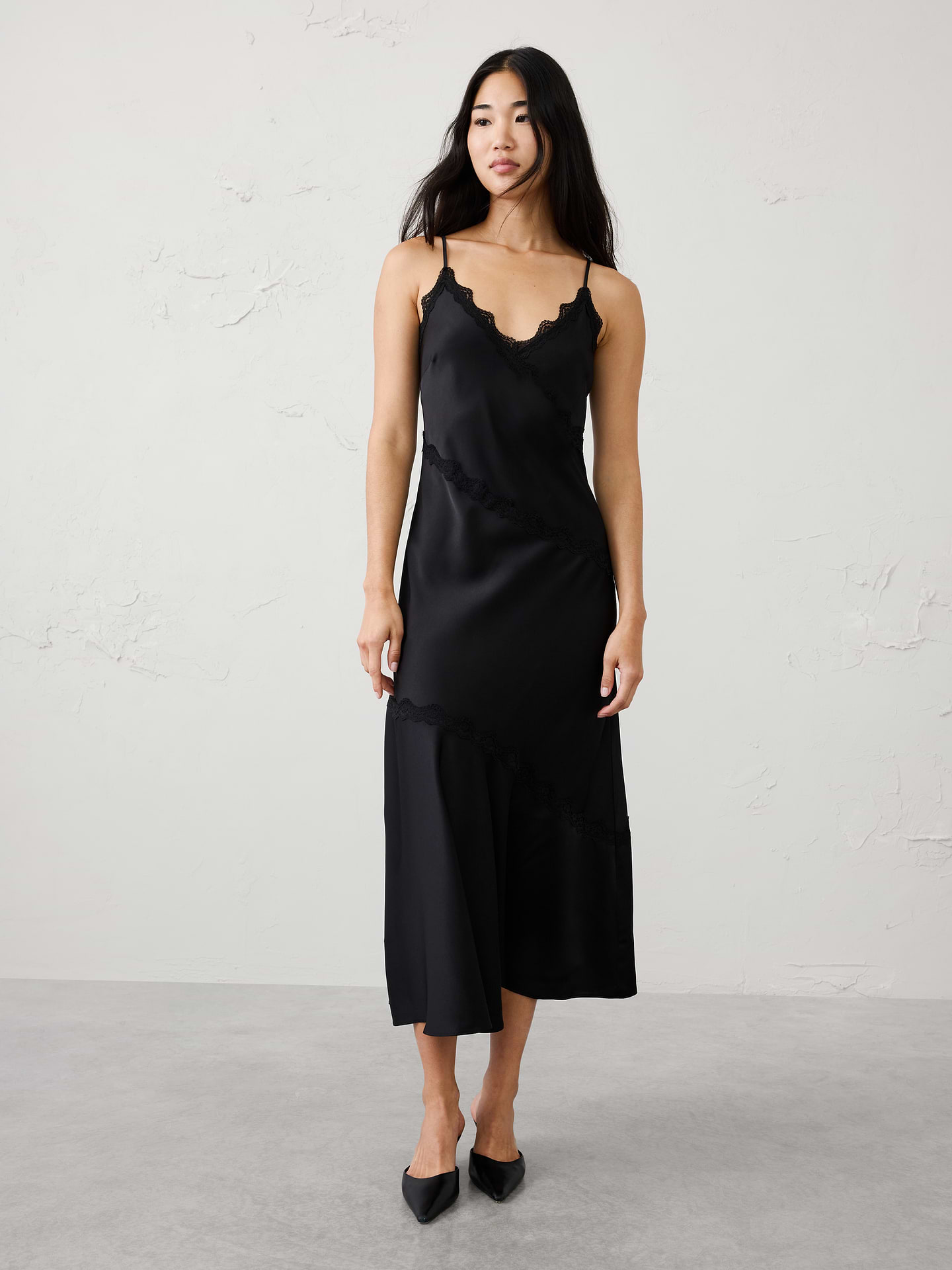 Image 1 of 8, Crafted from soft satin-back crepe, the bias-cut silhouette skims the figure for an effortlessly elegant look, while delicate lace trim traces the neckline and angled seam details for added femininity and dimension., V-neckline. Adjustable spaghetti straps., Delicate lace trim detailing throughout., Feminine slip-dress styling., Made exclusively for Banana Republic Factory., Product #1185690