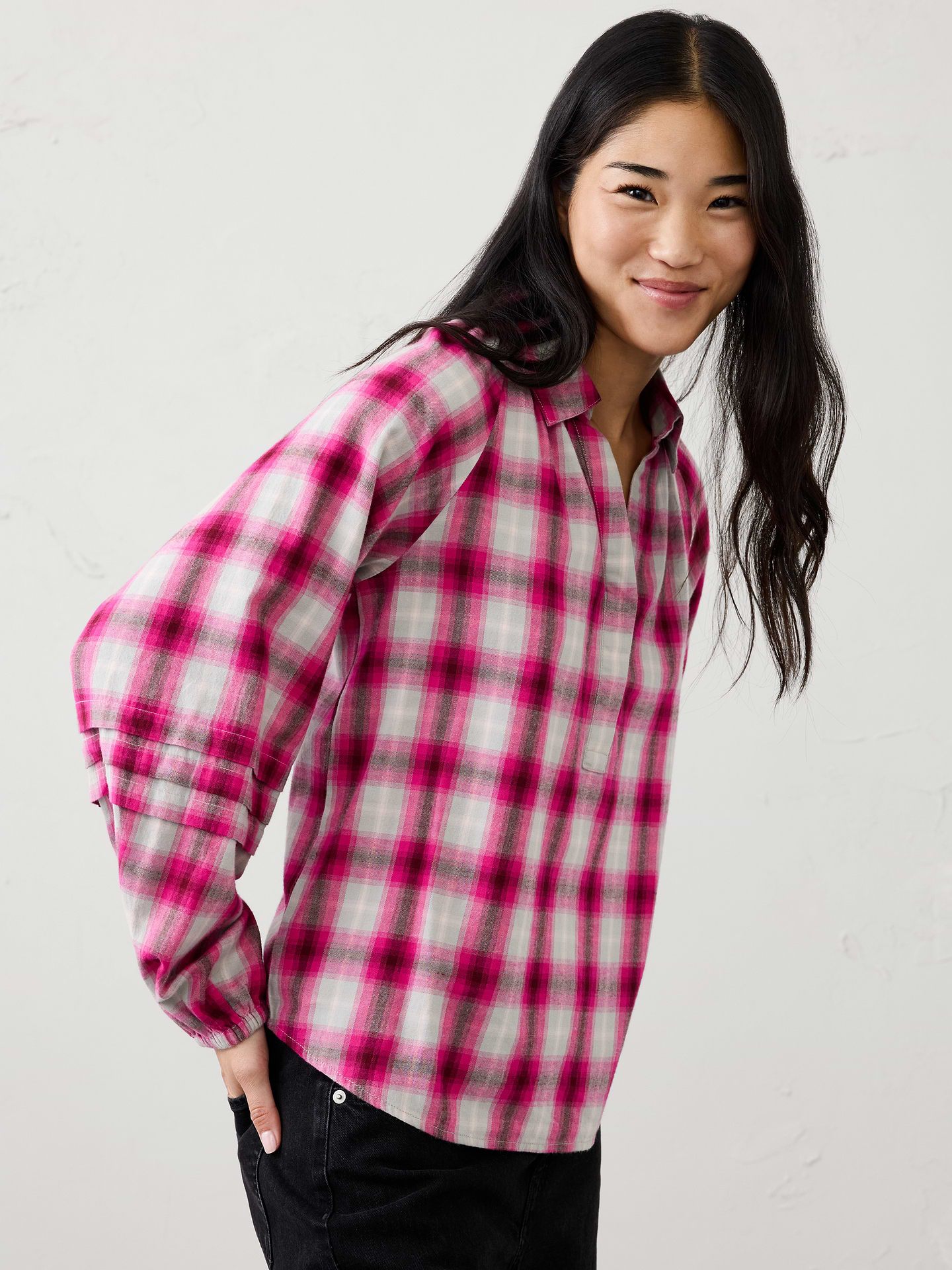 Image 1 of 3, Crafted in a soft plaid flannel, this blouse features feminine pleat‑sleeve detailing for an elevated touch. Cozy yet polished, it brings warmth, texture, and effortless style to holiday gatherings and seasonal everyday dressing., Pointed collar with split V‑neckline. Long raglan sleeves with elasticized cuffs., Soft pleating at the front and back neckline., Decorative pleat bands at the sleeves add texture and visual interest., Made exclusively for Banana Republic Factory., Product #1185915
