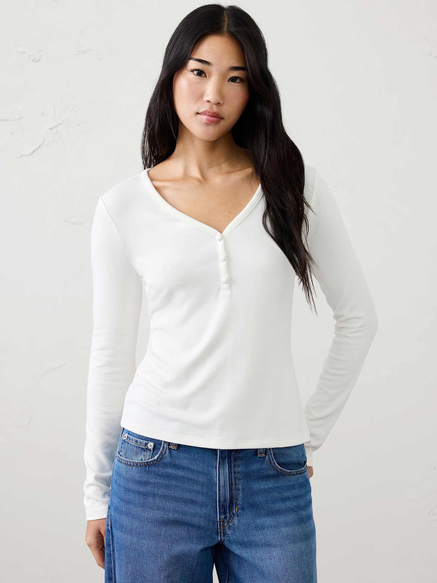Image 1 of 4, A customer favorite, our Soft Luxe knit returns as a cozy yet lightweight alternative to a traditional sweater. It offers versatile comfort that layers beautifully and transitions effortlessly through the season., Henley vee neckline. Long sleeves., Three button placket., Made exclusively for Banana Republic Factory., Product #1185999