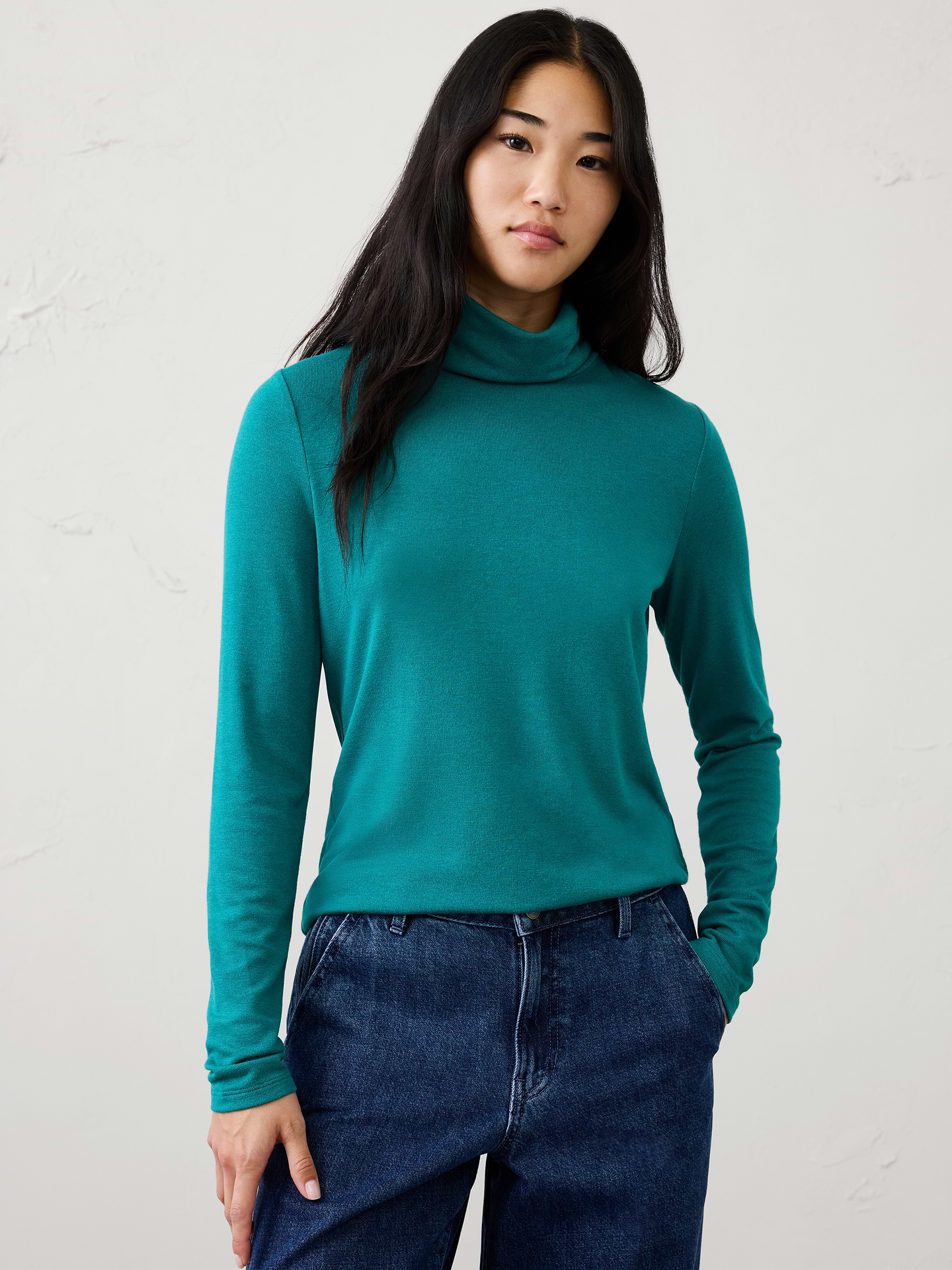Image 1 of 7, Soft Luxe Knit is back, bringing the perfect balance of cozy comfort and lightweight ease. Crafted with an ultra-soft feel, it’s an easy-to-wear alternative to traditional sweaters—ideal for layering now and transitioning seamlessly through the seasons., Turtleneck. Long sleeves., Straight hem., Made exclusively for Banana Republic Factory., Product #1178104