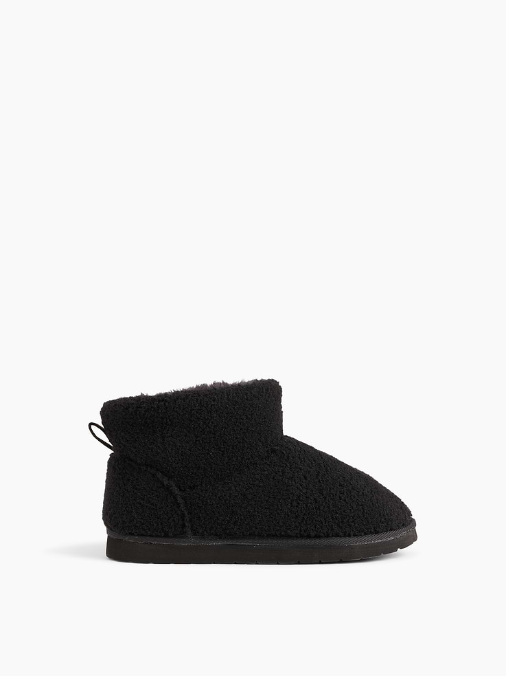 Image 1 of 4, These boots are made with a soft sherpa upper and cozy faux fur lining., Rubber gripper sole., This product was made in a factory that invests in gender equity and women’s empowerment through RISE. Learn more at gapinc.com/equity ., Product #1185932