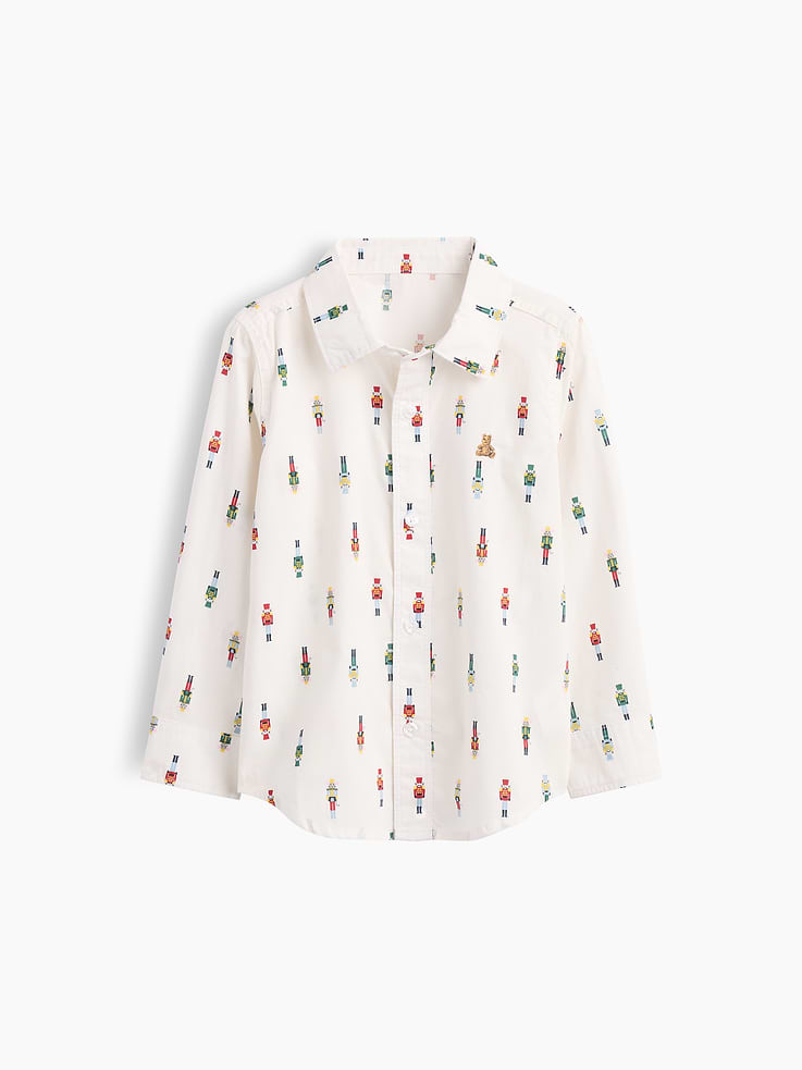 Image 1 of 3, Smooth poplin weave., Long sleeves with button cuffs., Spread collar, button front., Select styles have embroidered Brannan Bear graphic at chest., Curved shirttail hem., Select styles have allover print or stripes., This product was made in a factory that invests in gender equity and women’s empowerment through RISE. Learn more at, Product #1178991