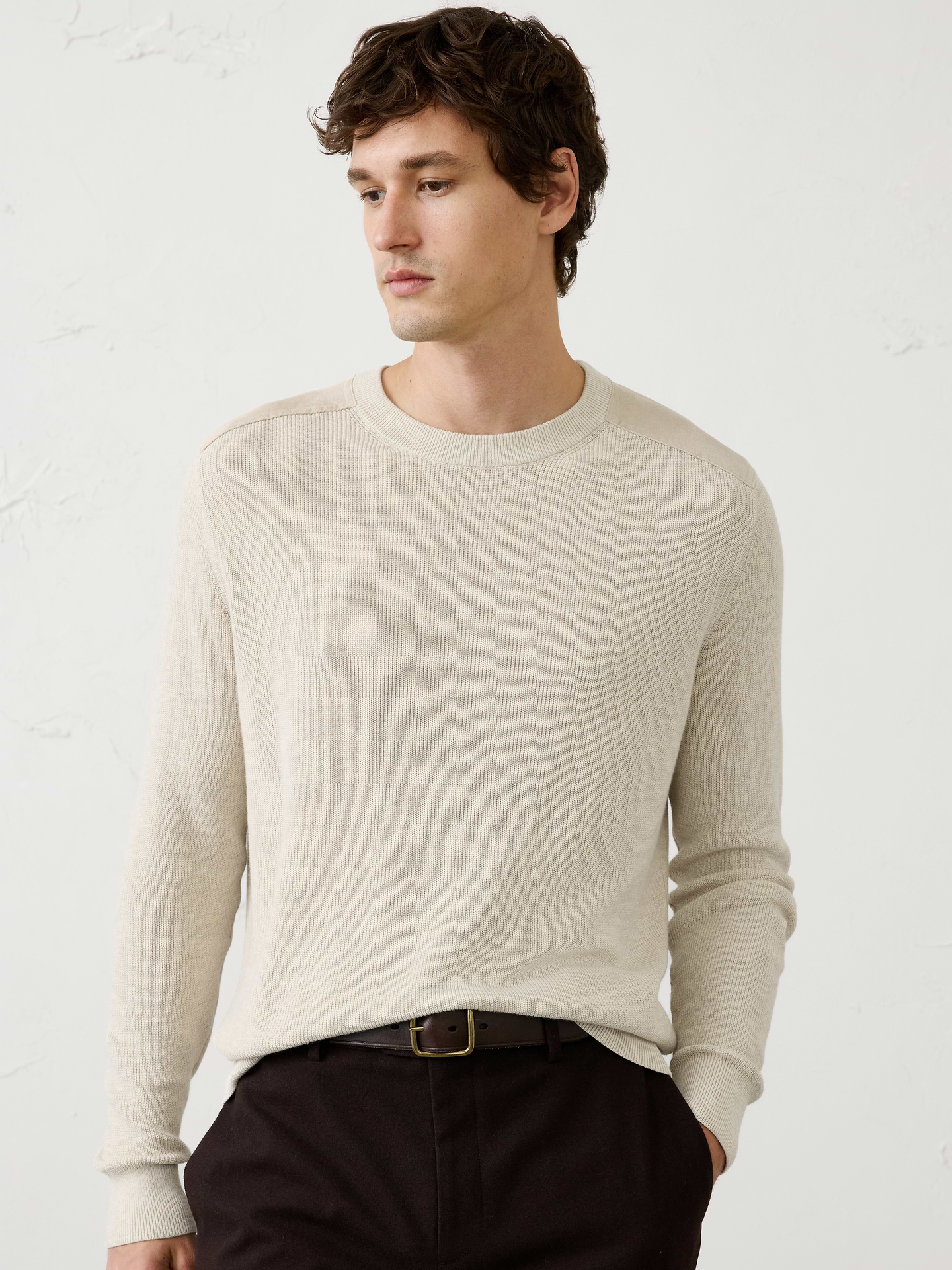 Image 1 of 3, This crewneck sweater features an allover ribbed stitch that adds rich texture and dimension to a classic silhouette. A tonal vegan suede patch at the shoulder provides a subtle contrast and elevated detail, making this an easy standout piece., Crew neck. Long sleeves., Ribbed neck, arm cuffs and hem., Made exclusively for Banana Republic Factory., Product #1175521