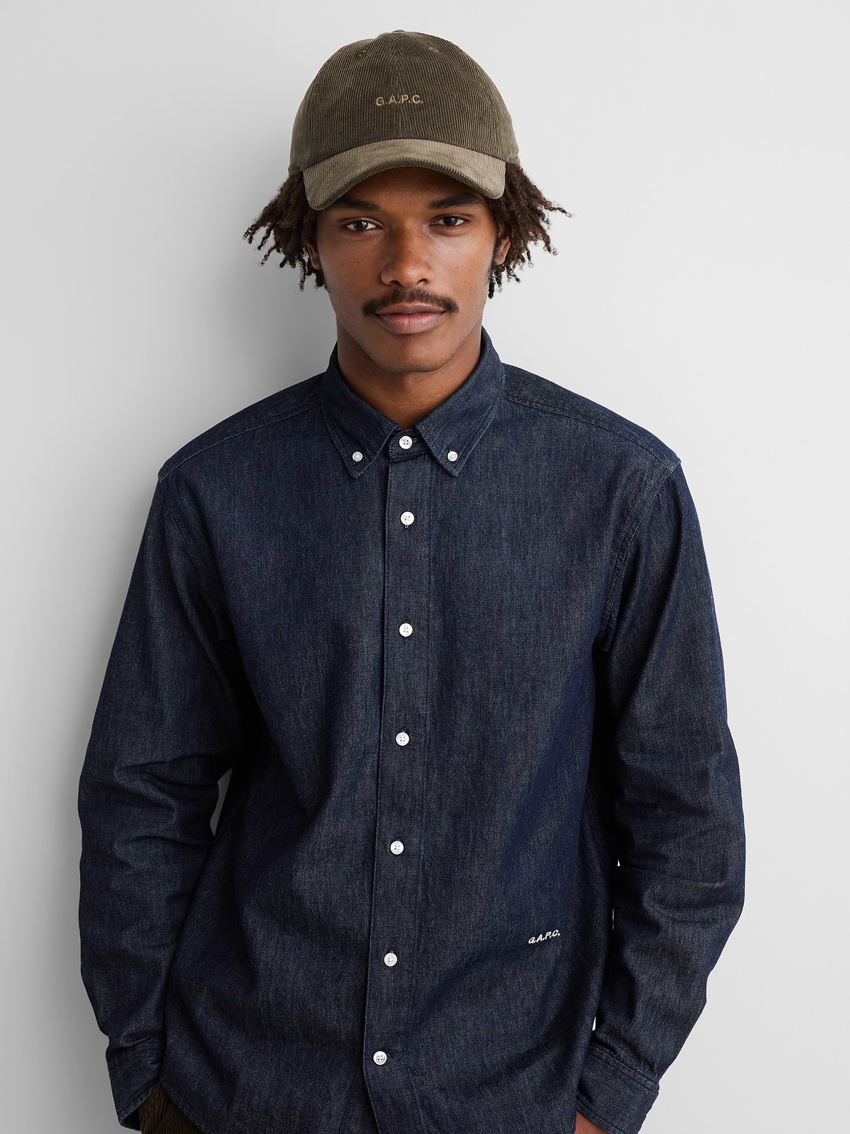 Image 1 of 5, Sturdy, 6-panel ribbed corduroy baseball hat., Stitching at curved brim., Adjustable closure at back., Embroidered Gap x A.P.C. logo at front., Product #1179743