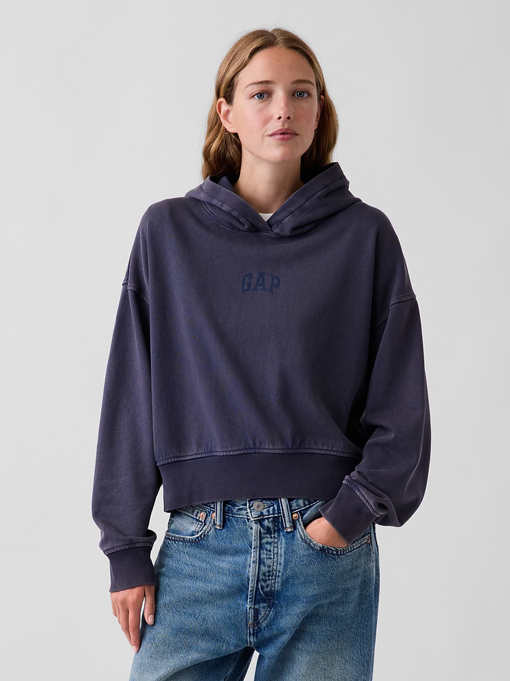 Image 1 of 5, Soft cotton-blend French terry hoodie. In an oversized, slightly cropped fit., Hooded neckline., Long sleeves with drop shoulders., Gap arch logo at front and back., Banded rib hem and cuffs., This product was made in a factory that invests in gender equity and women’s empowerment through RISE. Learn more at gapinc.com/equity ., Product #1196048