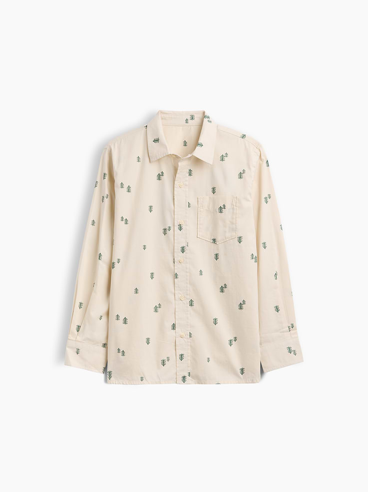 Image 1 of 3, Smooth poplin weave., Long sleeves with button cuffs., Spread collar, button front., Patch pocket at chest., Curved shirttail hem is longer at back., Select styles have allover print or stripes., This product was made in a factory that invests in gender equity and women’s empowerment through RISE. Learn more at, Product #1175304