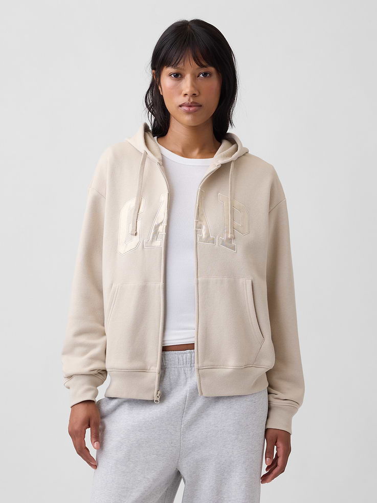 Image 1 of 5, Soft, comfy fleece., Dropped shoulder, long sleeves with banded cuffs., Drawcord ties at hood, zip front., Gap logo at front., Kanga pockets., Banded hem., Note: The dye used in the crafting of this product is prone to crocking, or color transfer. Please avoid contact with light-colored fabric or upholstery., Product #627454